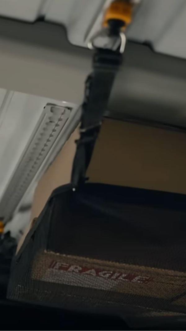 Close-up of Roof-L-Track rail mounted on the KIA PV5 cargo wall